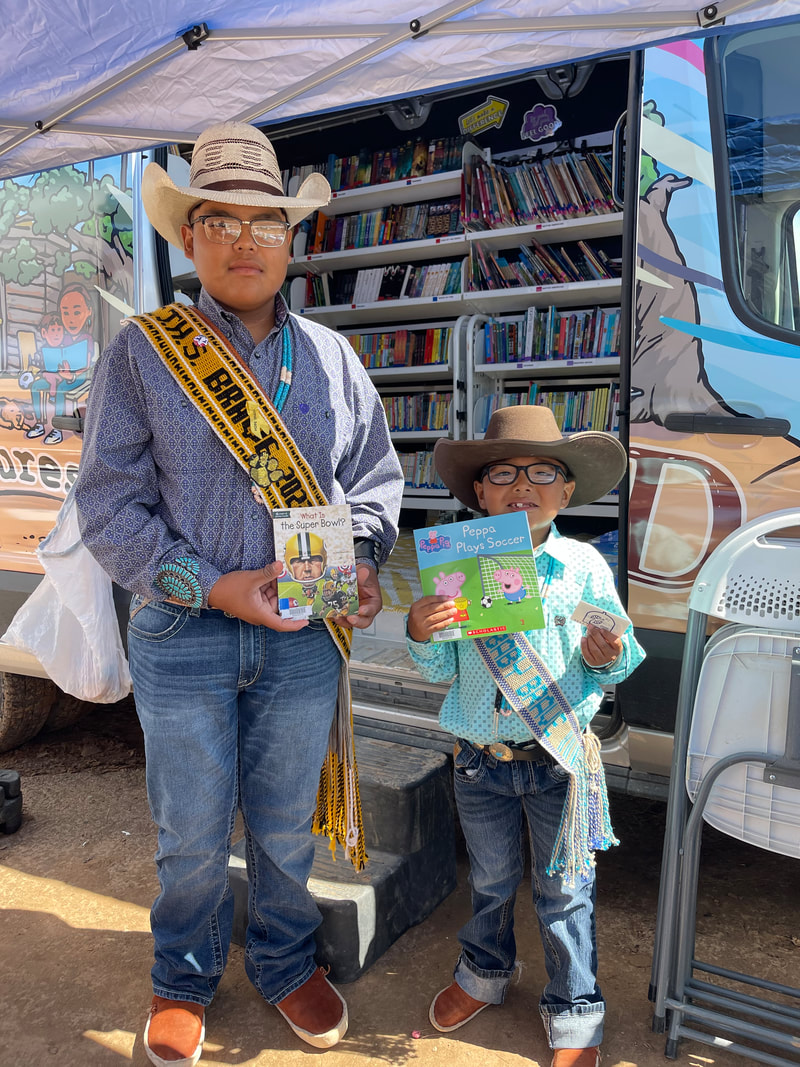 Boys reading books at open house